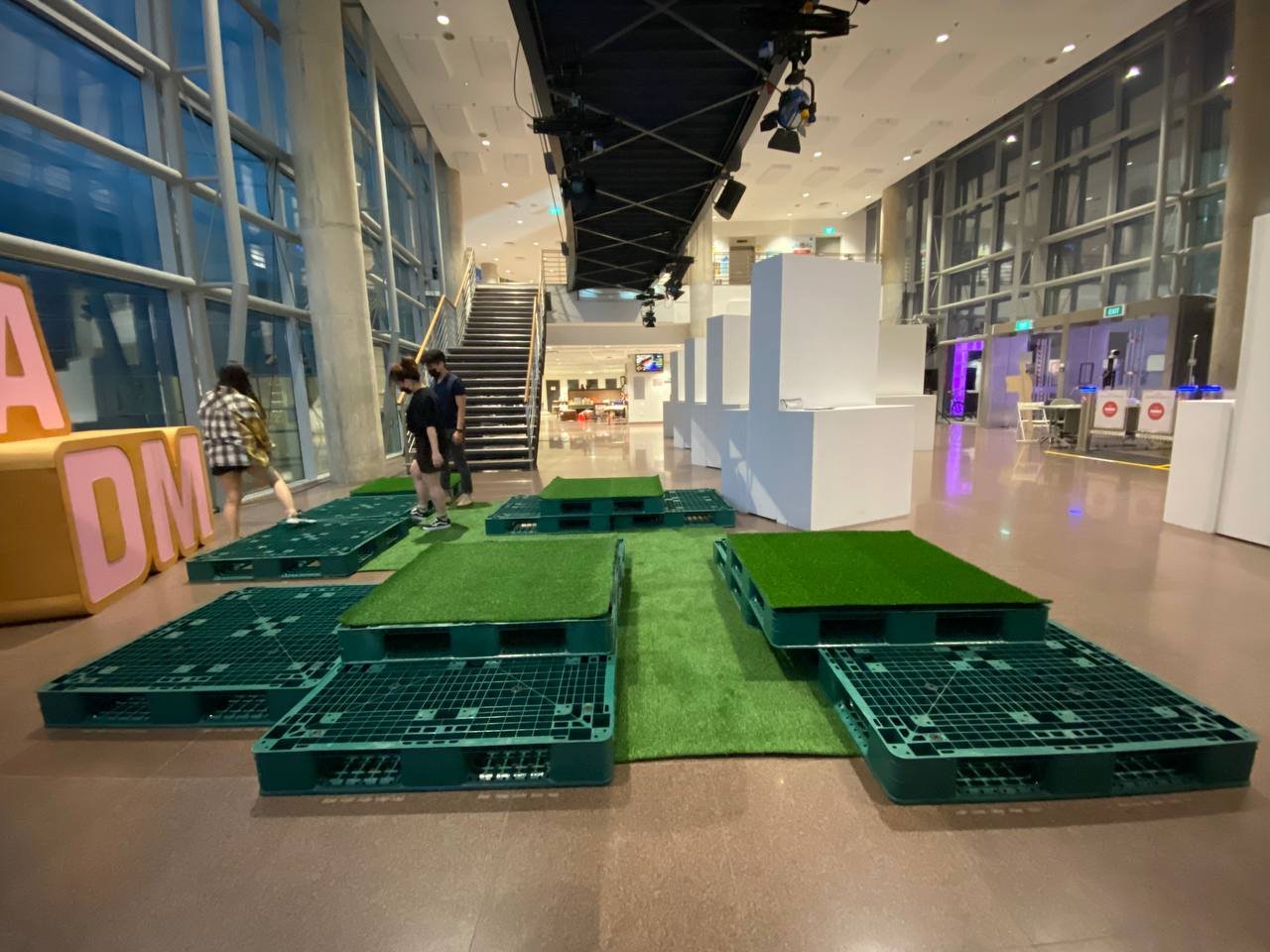 We laid out the pallets and grass in the lobby area in front of an LED screen